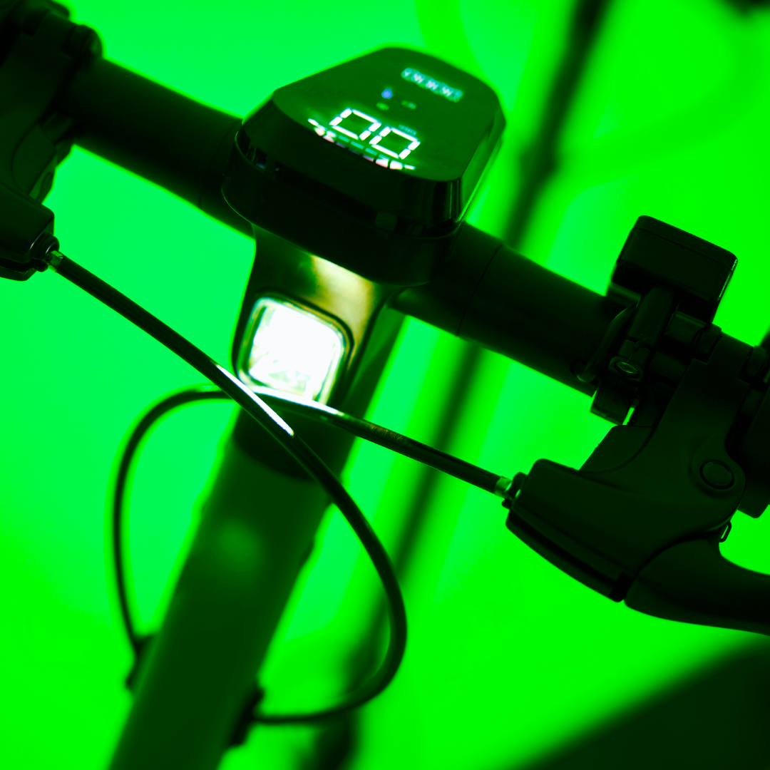 LOCO City electric scooter headlight and display illuminated in low light conditions