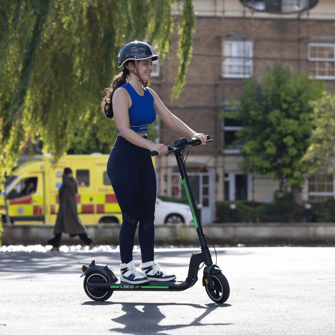 Person riding the LOCO Lite electric scooter in Dublin city