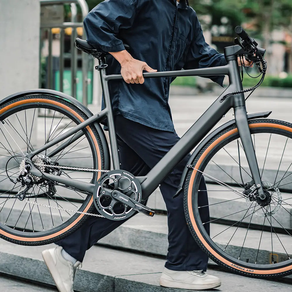 Fiido C21 lightweight electric bike wheeled by its rider
