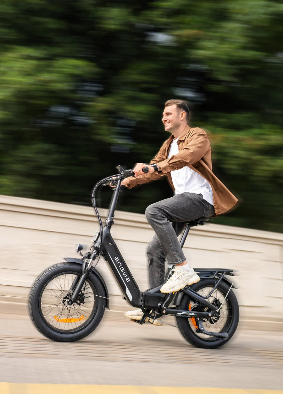 Rider using the Engwe L20 3.0 Boost electric bike in an urban setting