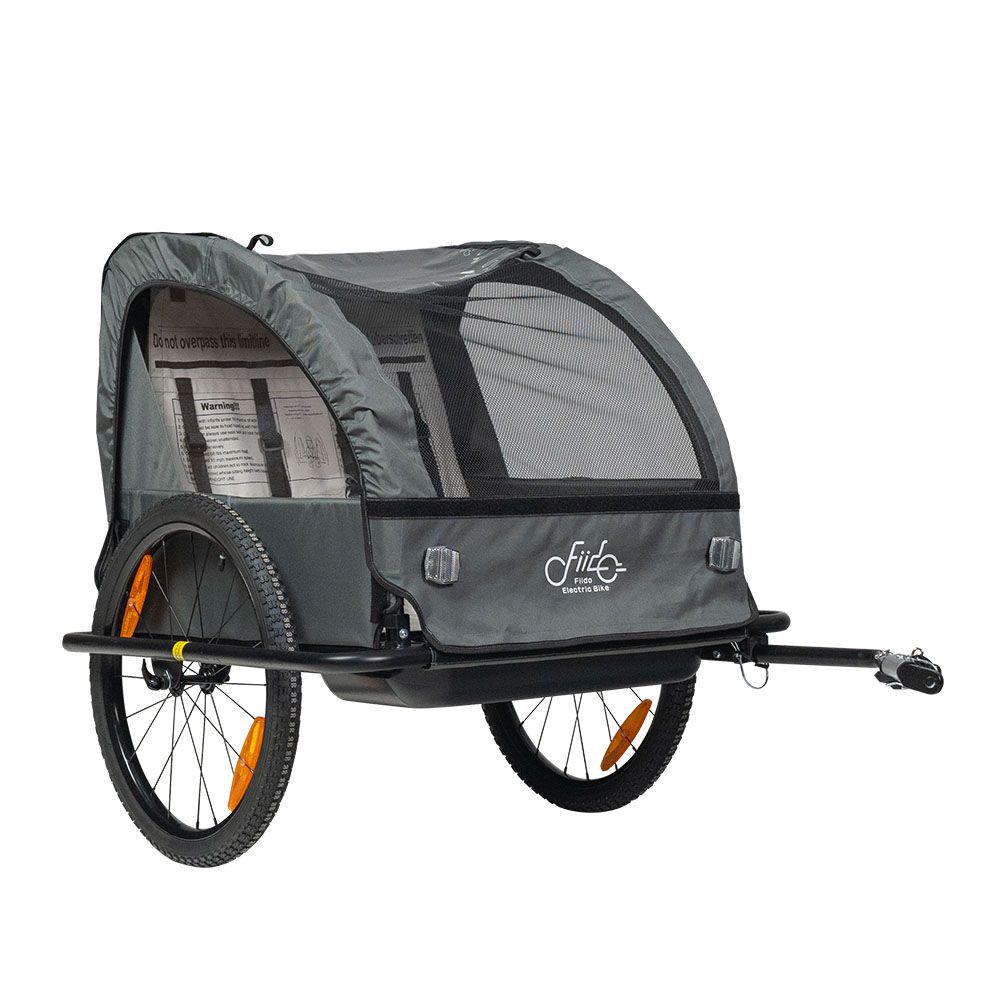 Gray bicycle trailer with a small window on a white background